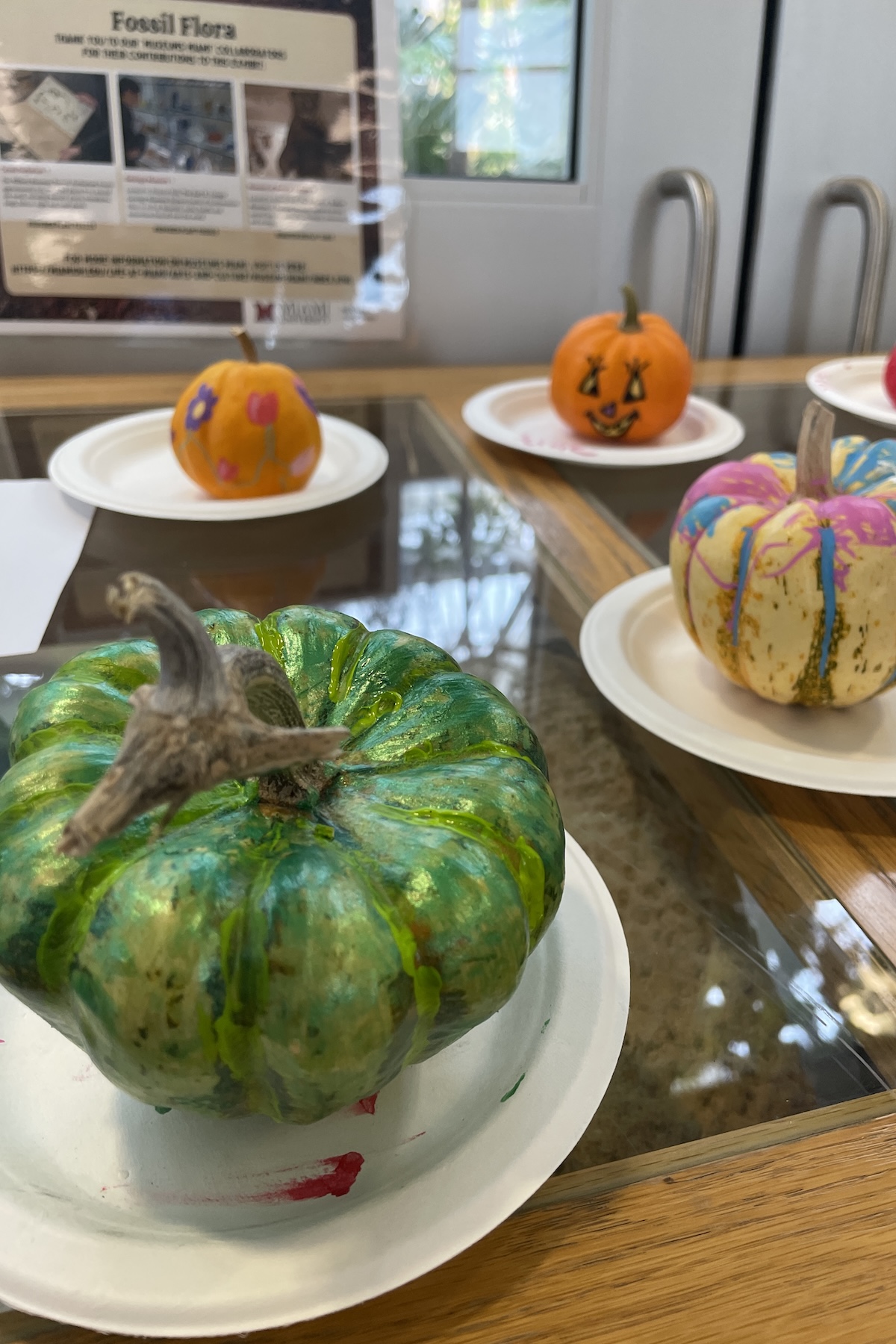 Painting pumpkins at the conservatory at Miami University Hamilton.