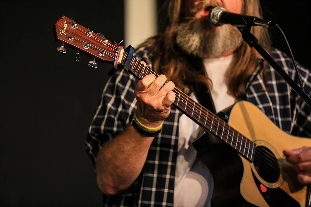 Person playing the guitar.